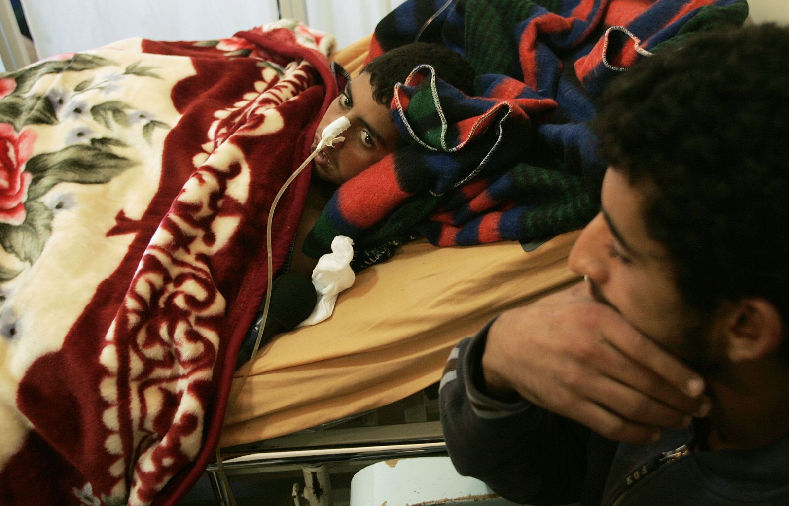 Palestinian Samouni lies in bed at Al-Quds hospital in Gaza