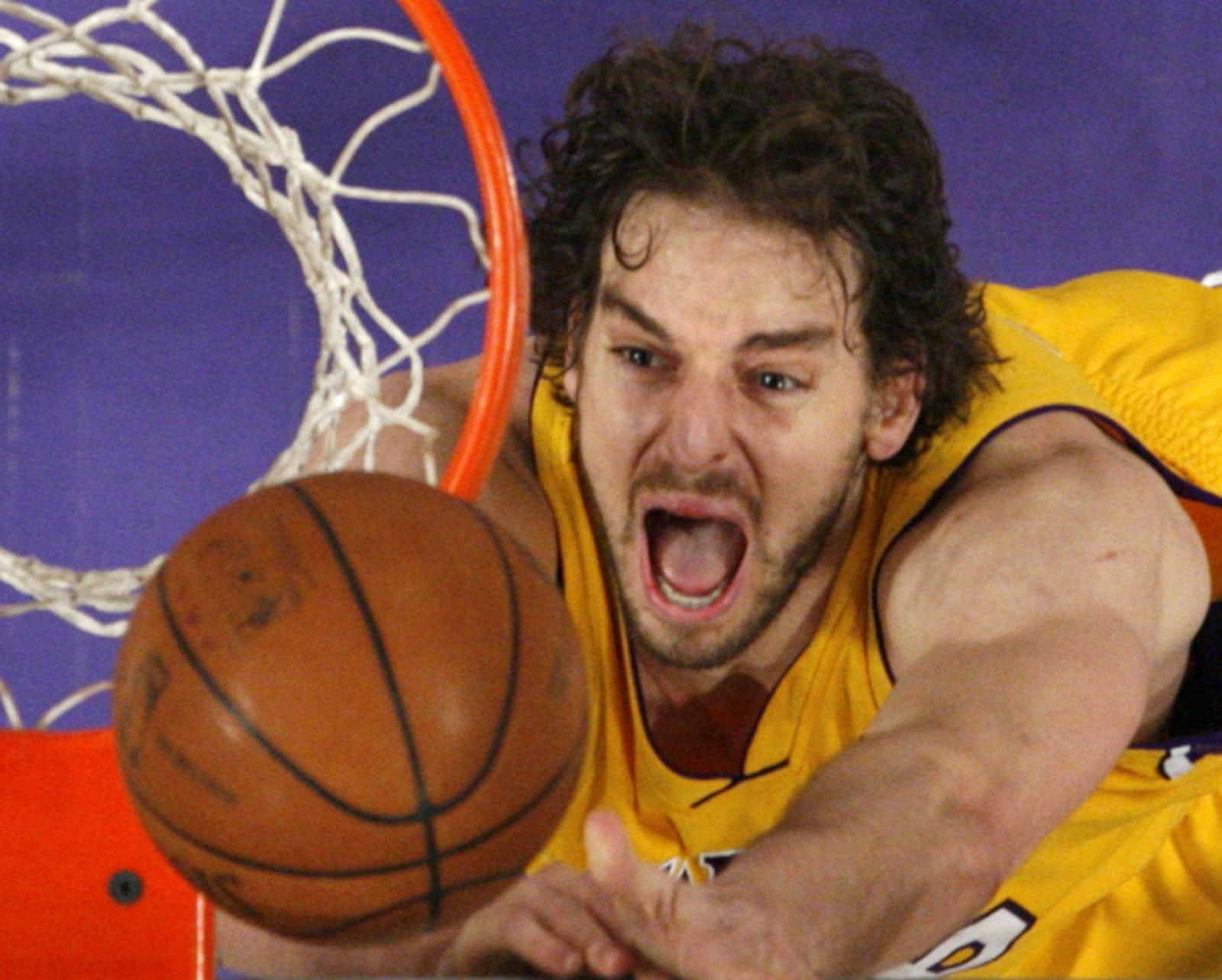 Lakers' Gasol jumps for a rebound against the Cavaliers in Los Angeles