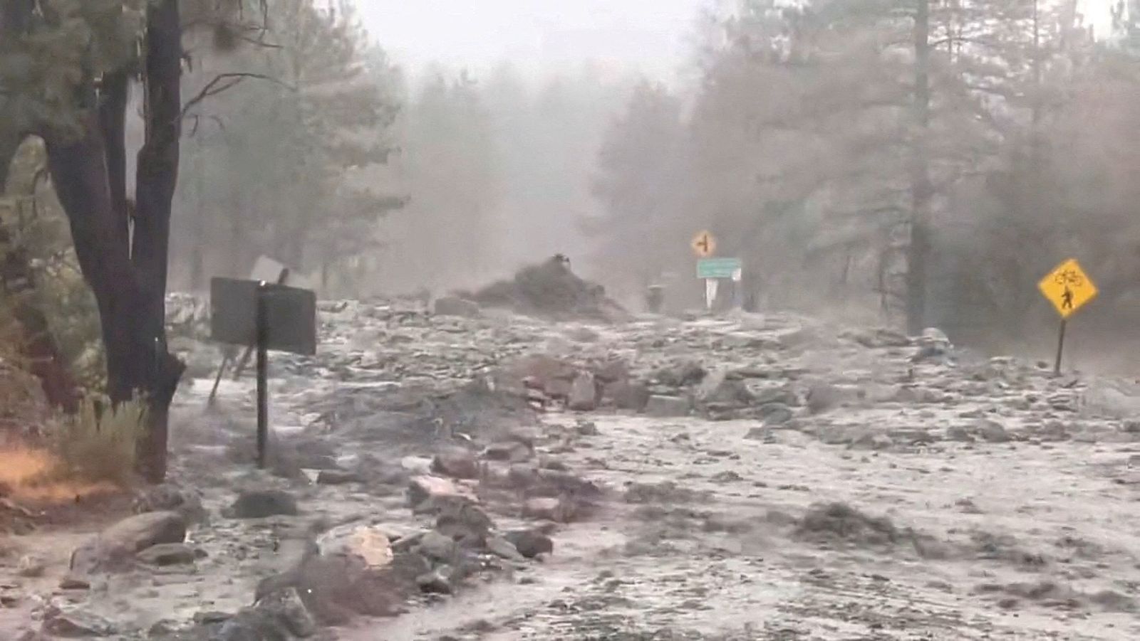 Flood water and debris are seen during Tropical Storm Hilary, in Angeles National Forest