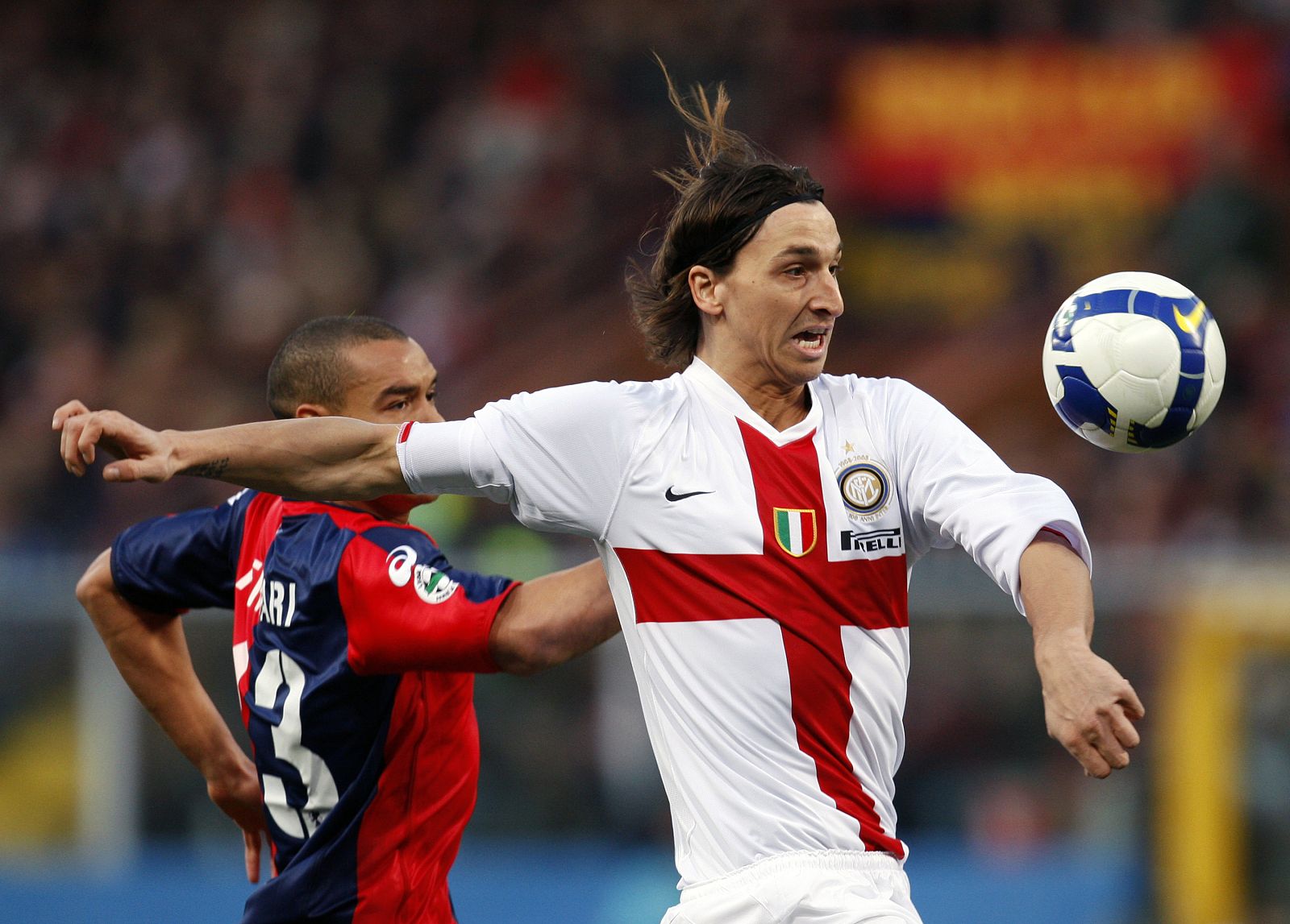 Inter Milan's Ibrahimovic controls the ball to score against Genoa during their Italian Serie A soccer match in Genoa