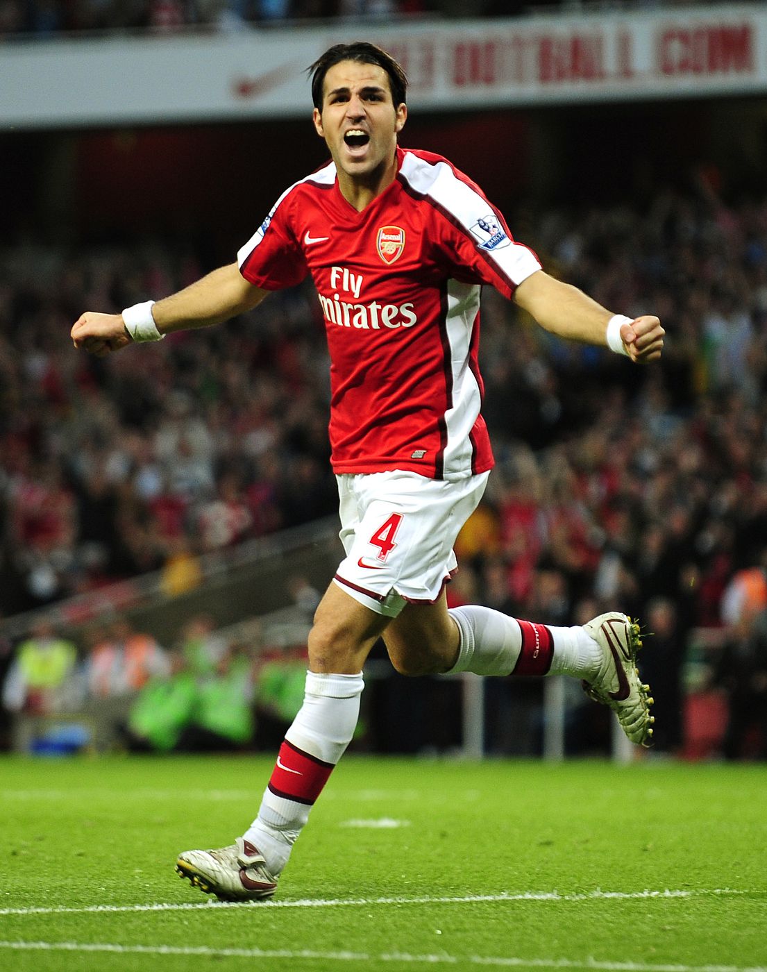 Arsenal's Fabregas celebrates after scoring against Hull City during their English Premier League match in London