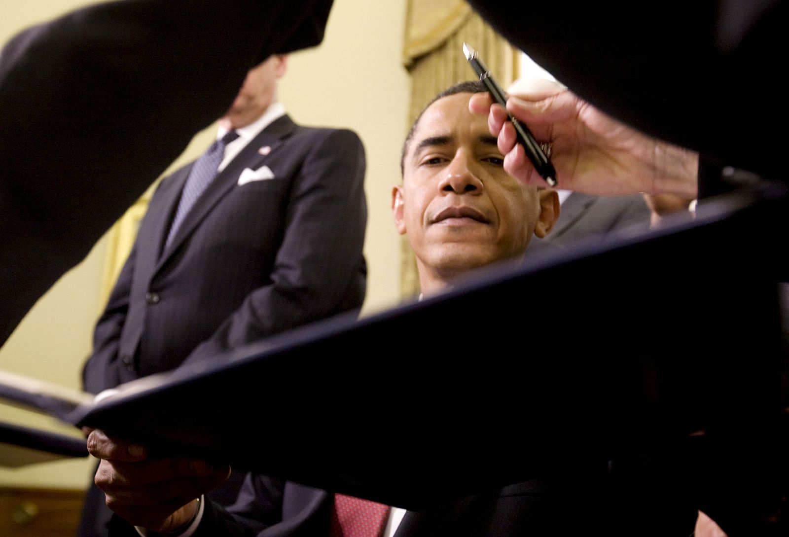 Obama is seen during signing of executive orders about closing of military prison at Guantanamo, on seconda day at White House in Washington