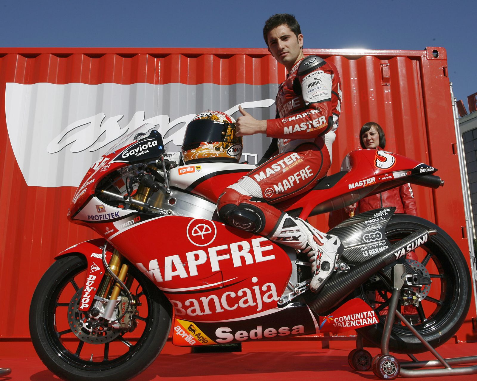 Aspar Team 250cc rider Hector Faubel of Spain sits on his new Aprilia at the team's official presentation in Valencia