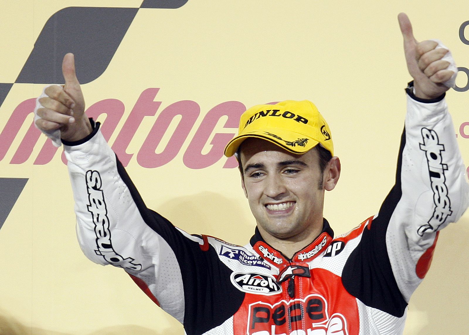 Spain's Hector Barbera celebrates on the podium after the 250cc race at the Losail international circuit in Doha