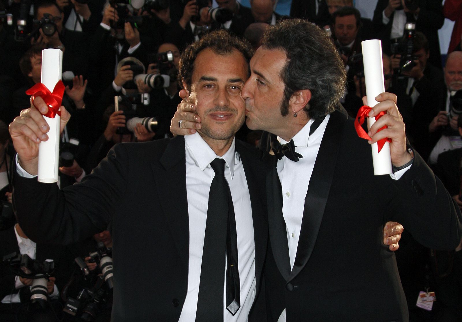 Italian directors Sorrentino and Garrone attend a photocall after the awards ceremony in Cannes