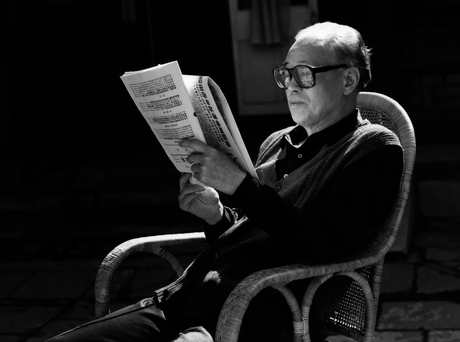 Former reformist Communist Party general secretary Zhao reads newspaper in garden of his home in central Beijing