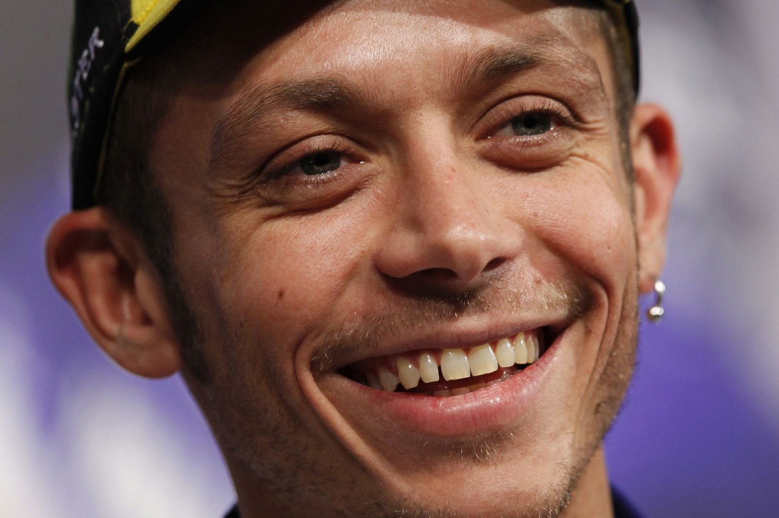 Yamaha MotoGP rider Valentino Rossi of Italy smiles during a news conference in Tokyo