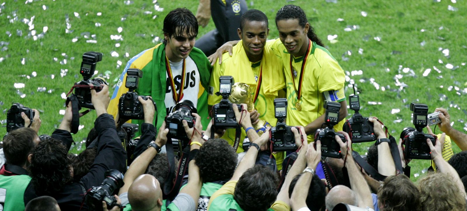 Brazil's captain Ronaldinho Robinho and Kaka pose after winning Confederations Cup final in Frankfurt.