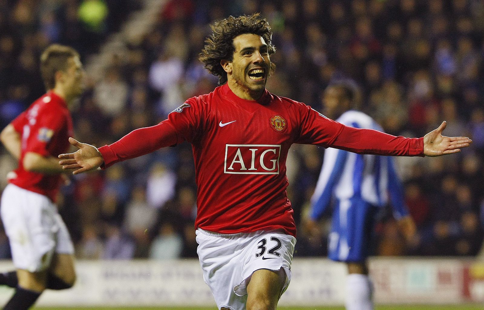 Manchester United's Tevez celebrates after scoring during their English Premier League soccer match against Wigan Athletic in Wigan