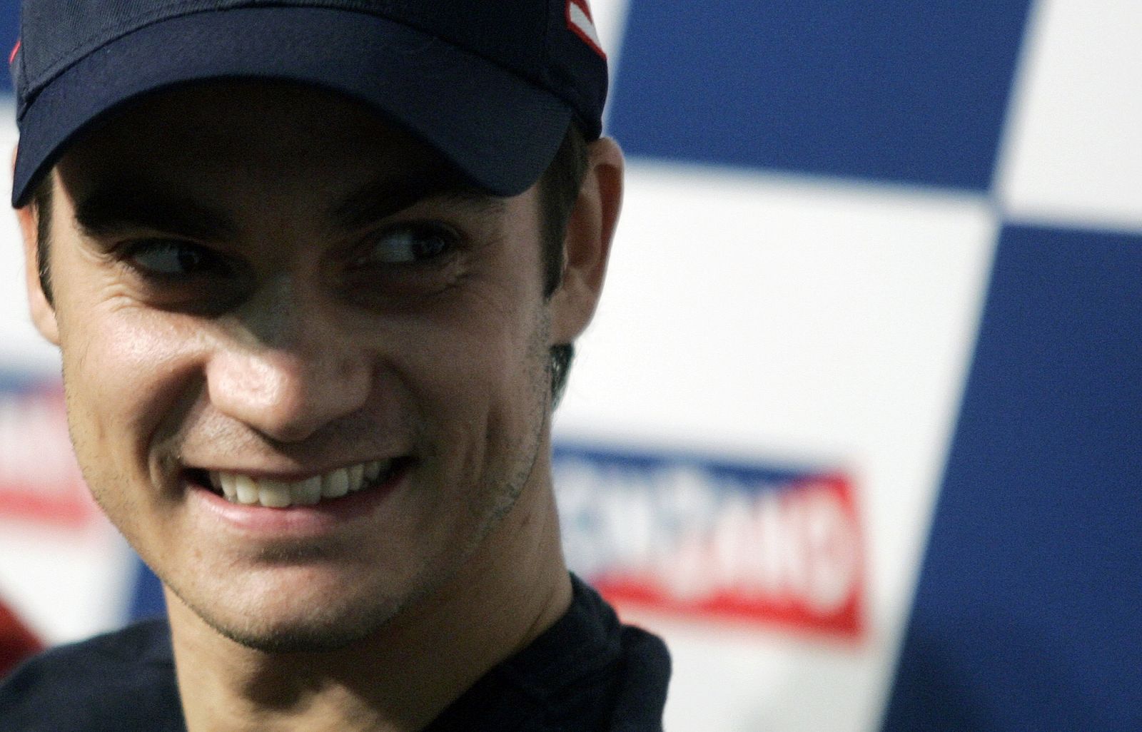 Honda MotoGP rider Dani Pedrosa of Spain smiles during a news conference ahead of the Spanish Grand Prix at Montmelo racetrack