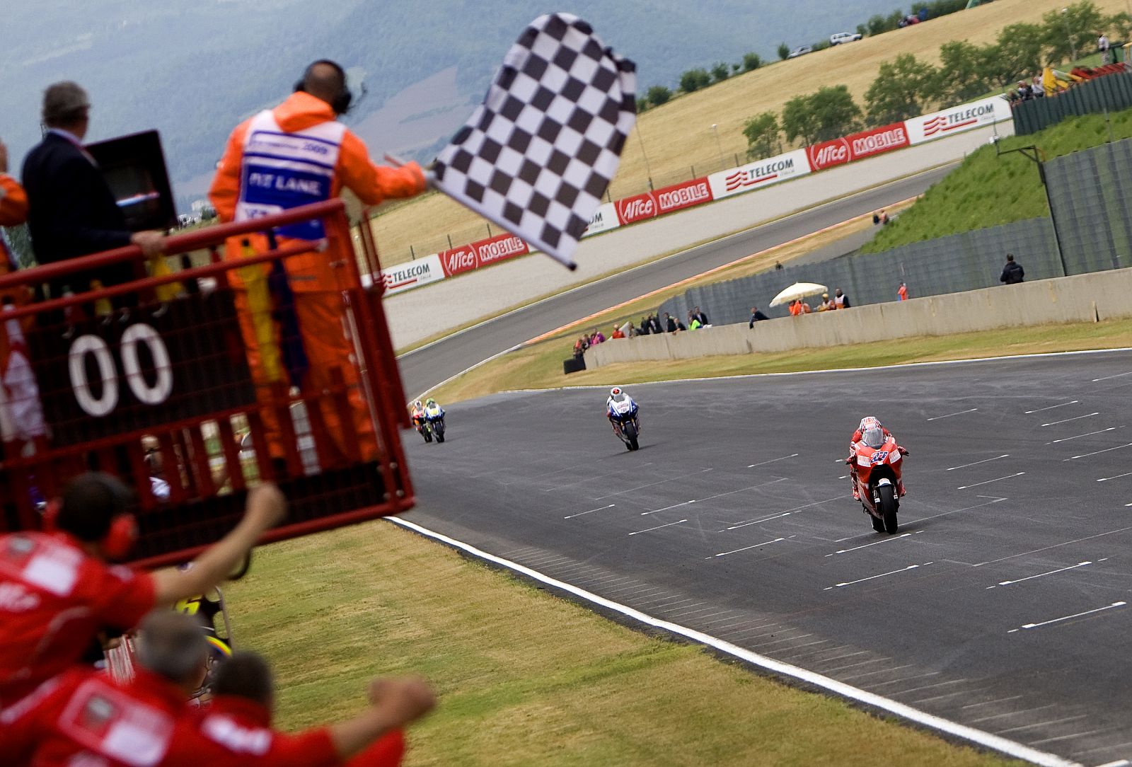 Ducati MotoGP rider Stoner of Australia crosses finish line to win MotoGP motorcycling Italian Grand Prix at the Mugello circuit