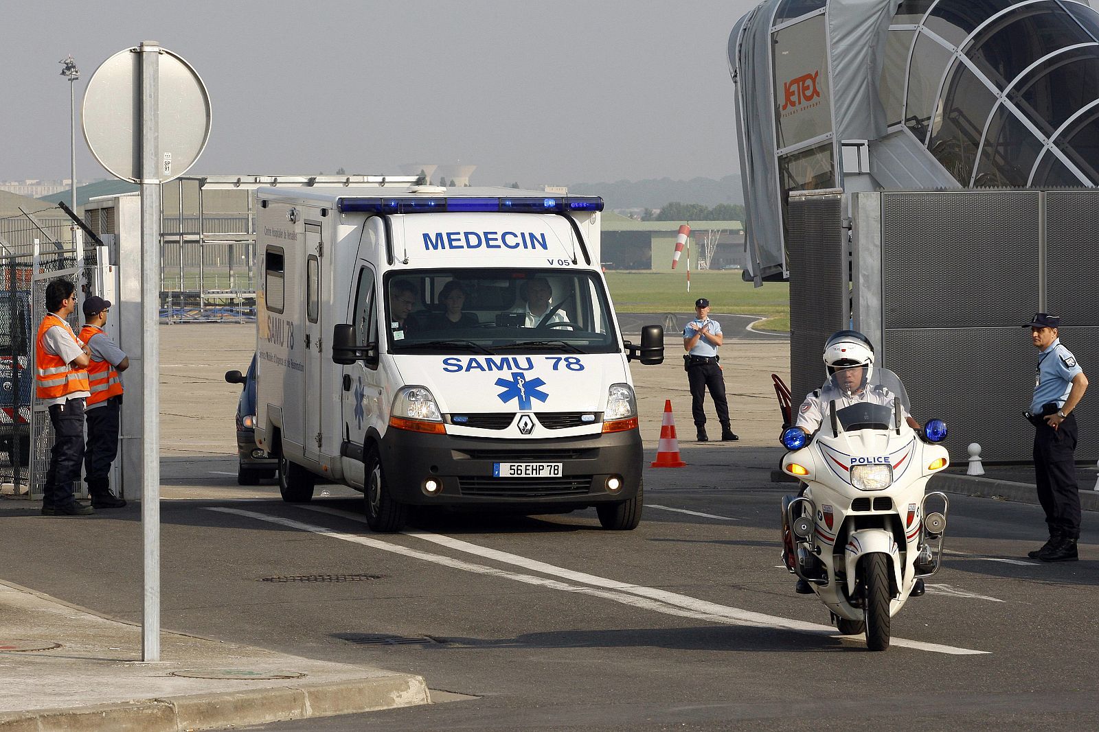Ambulance escorts Bakari, lone survivor of crashed Yemenia aircraft, at Le Bourget airport near Paris
