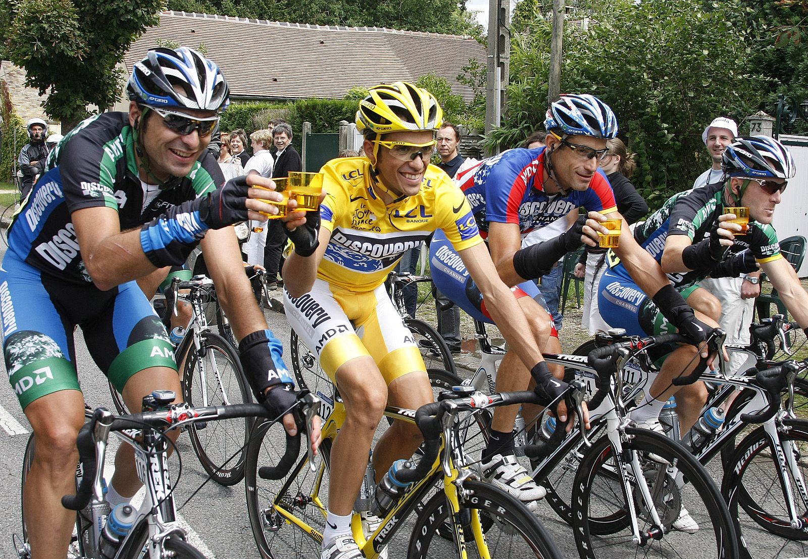 Discovery Channel team rider Contador raises a toast with his teamates during the final 20th stage of the 94th Tour de France