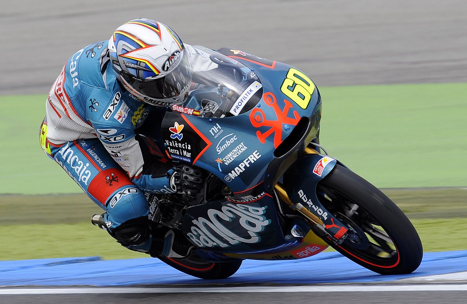 125 cc rider Simon of Spain takes a corner during qualifying practice of the Dutch Motorcycling Grand Prix in Assen