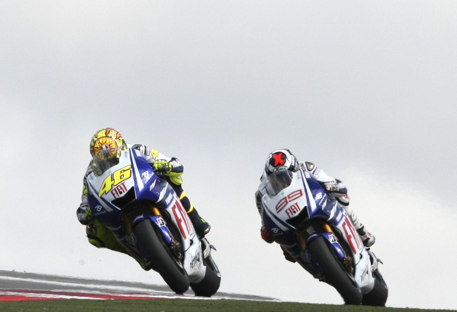 Yamaha MotoGP rider Rossi of Italy powers his bike ahead of team mate Lorenzo of Spain during German Grand Prix at Sachsenring circuit near Hohenstein-Ernsthal