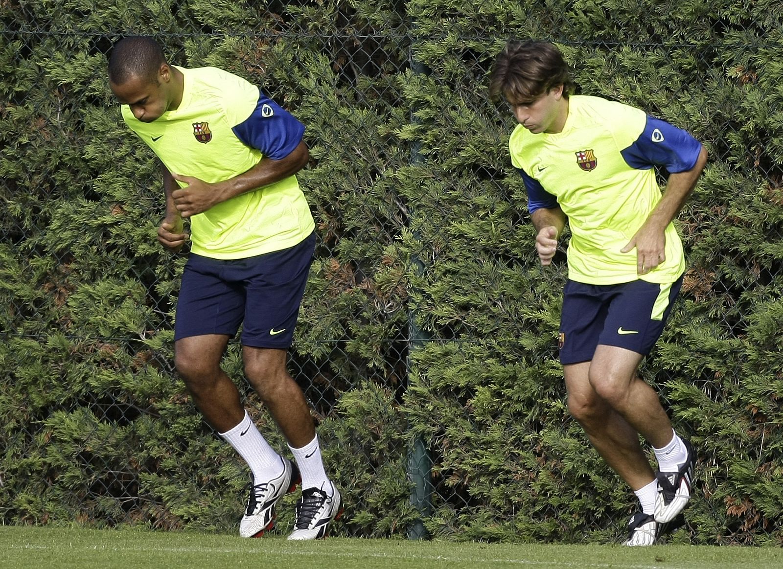 Thierry Henry of France and new signing Maxwell Scherrer of Brazil take part in a soccer training session in Barcelona