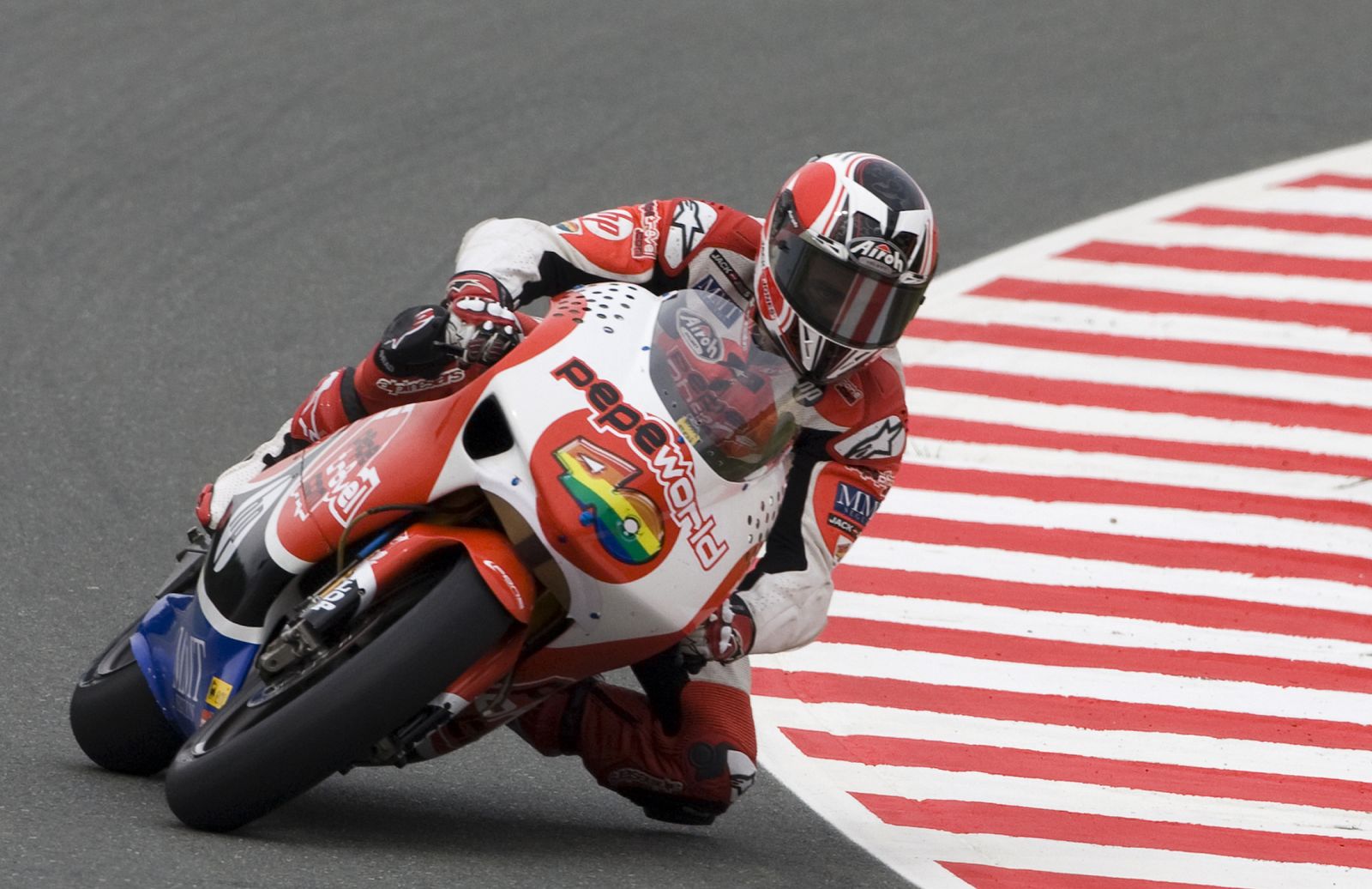 Aprilia 250cc rider Barbera of Spain takes a corner during the first free practice for the German Grand Prix at the Sachsenring circuit