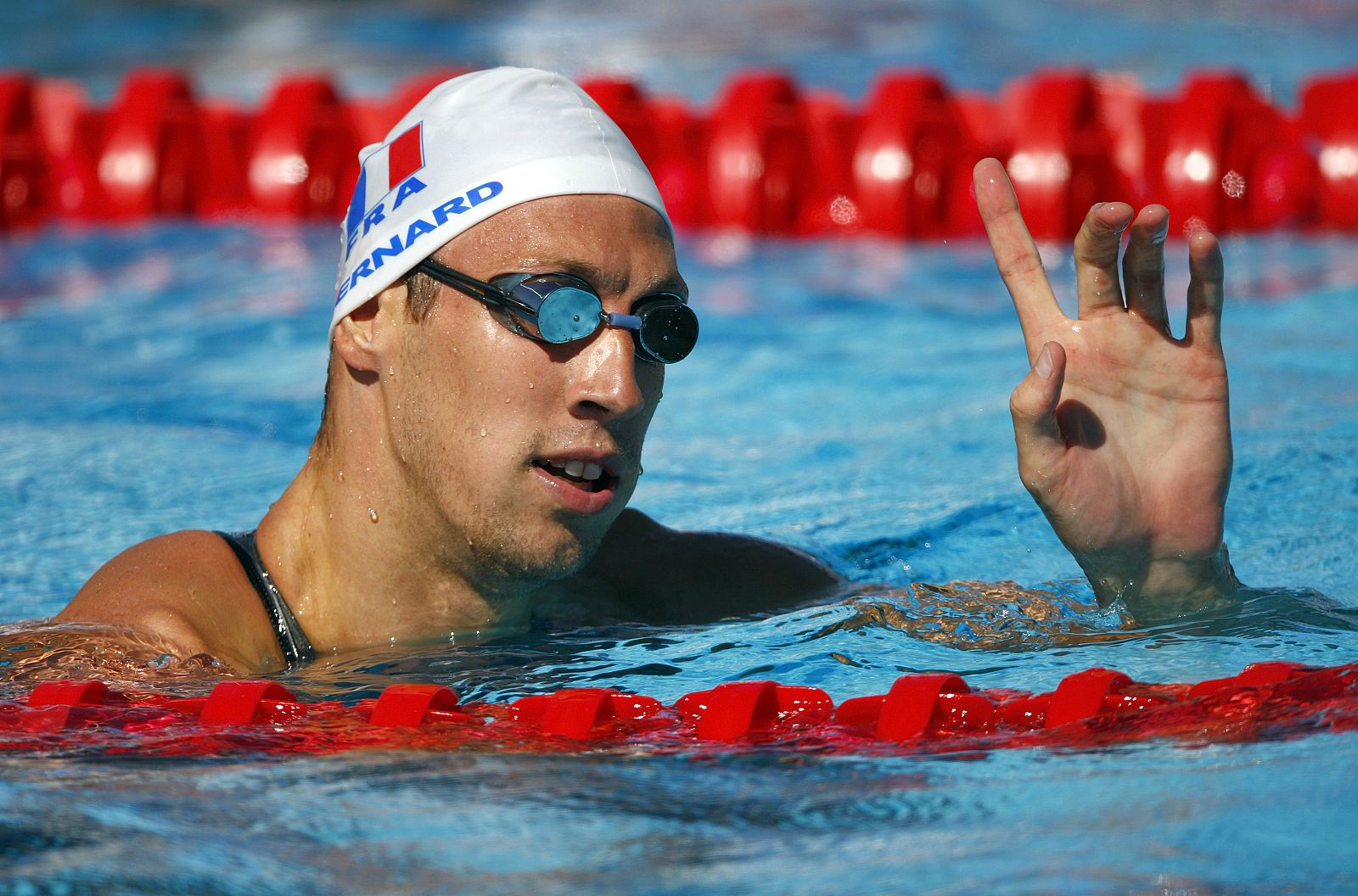 Bernard of France rests in the pool after competing in the men's 100m freestyle swimming heats at the World Championships in Rome