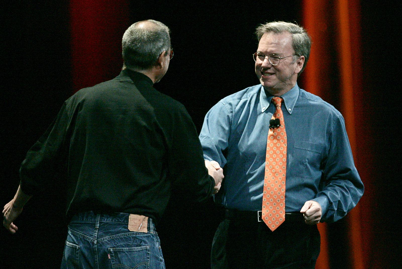 Apple Chief Executive Officer Steve Jobs shakes hands with Eric Schmidt, chief executive officer of Google, after introducing new iPhone in San Francisco