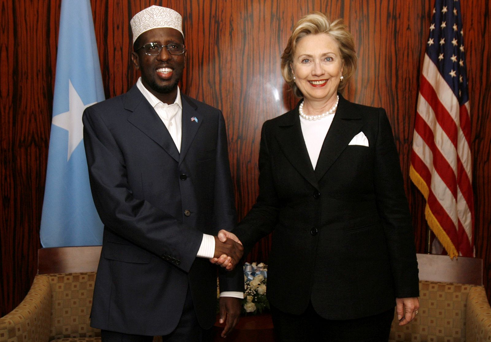 U.S. Secretary of State Clinton shakes hands with Somalia's President Sharif Ahmed during their meeting at the U.S. embassy in Nairobi