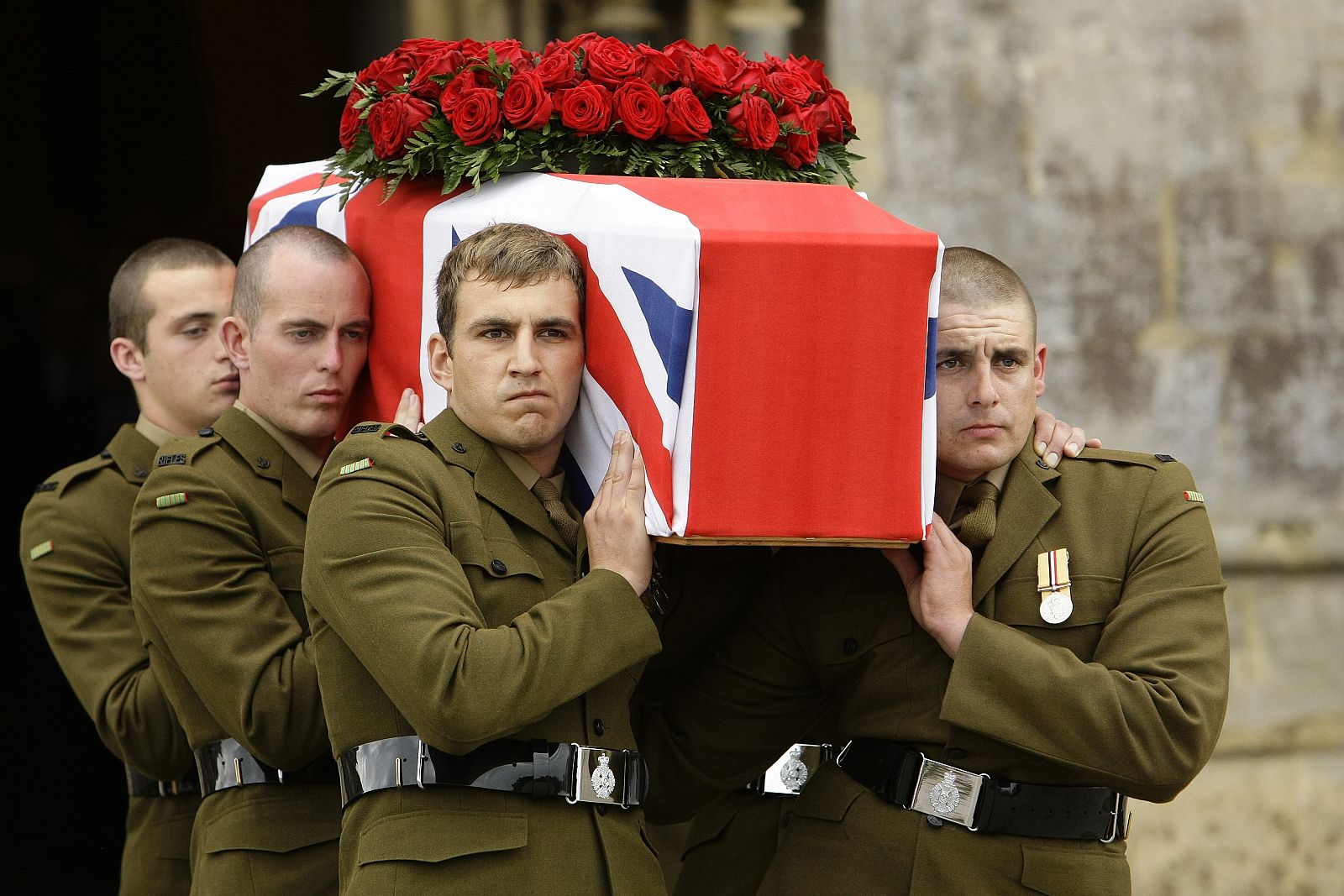Pall bearers carry the coffin of Harry Patch from Wells Cathedral, in western England