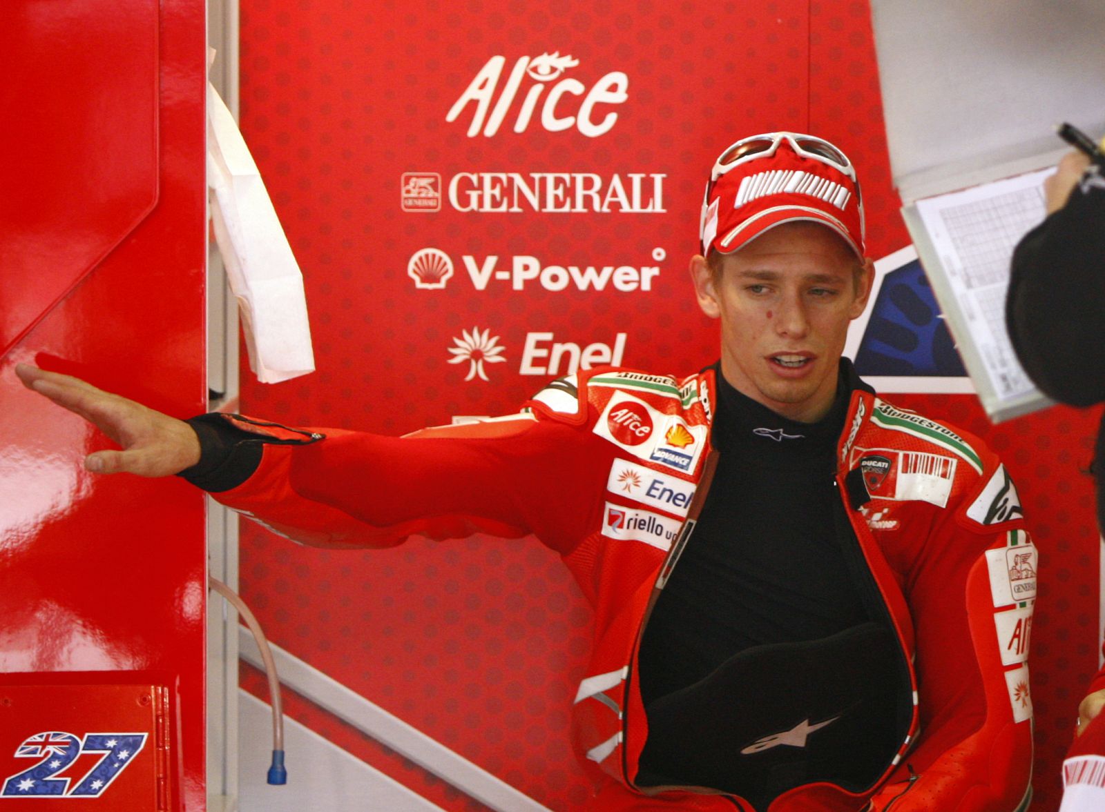 Ducati MotoGP rider Casey Stoner of Australia talks after second free practice for the German Grand Prix at Sachsenring circuit near Hohenstein-Ernsthal