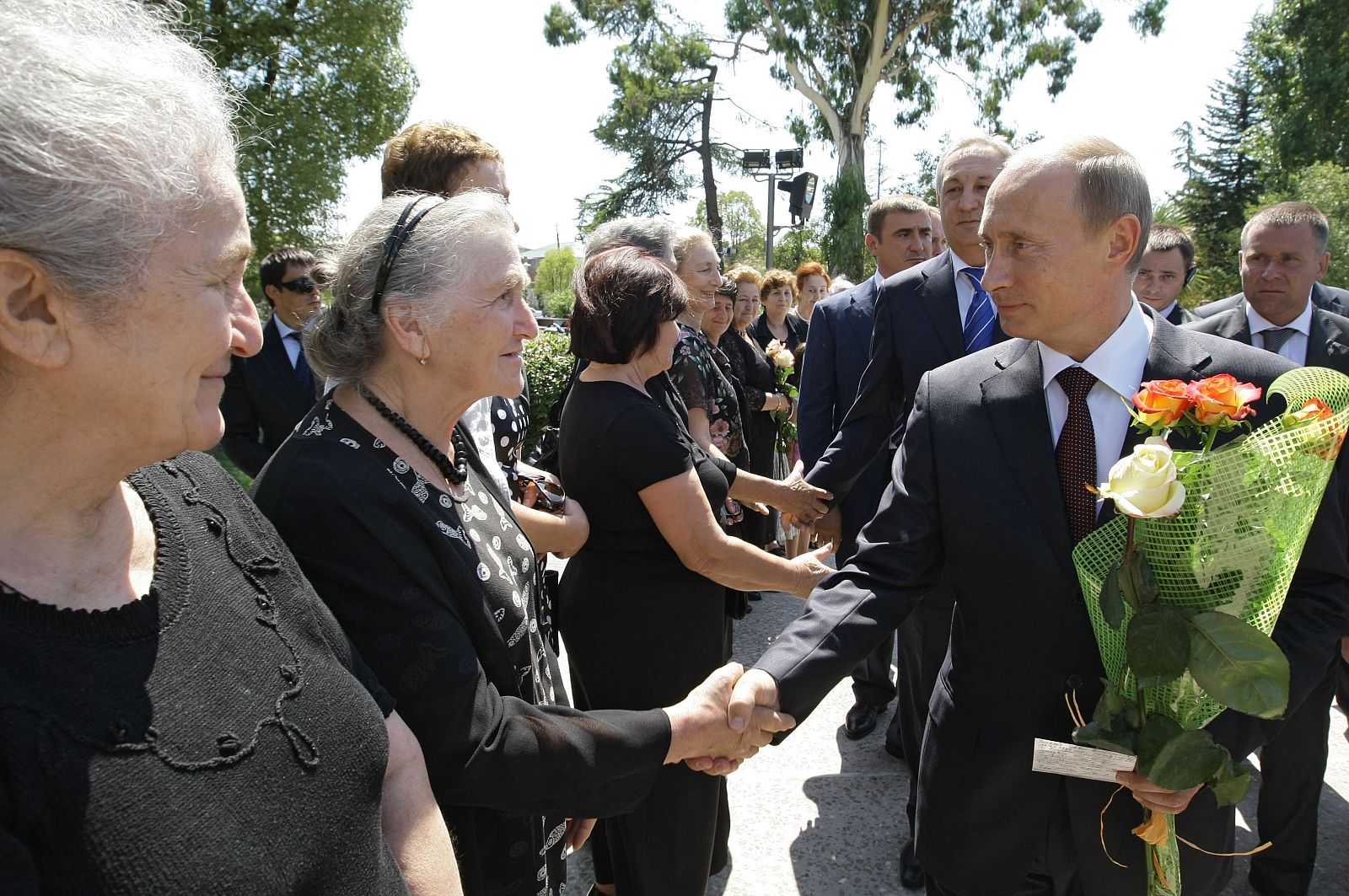 Russian Prime Minister Vladimir Putin meets people as he visits Sukhumi in Abkhazia