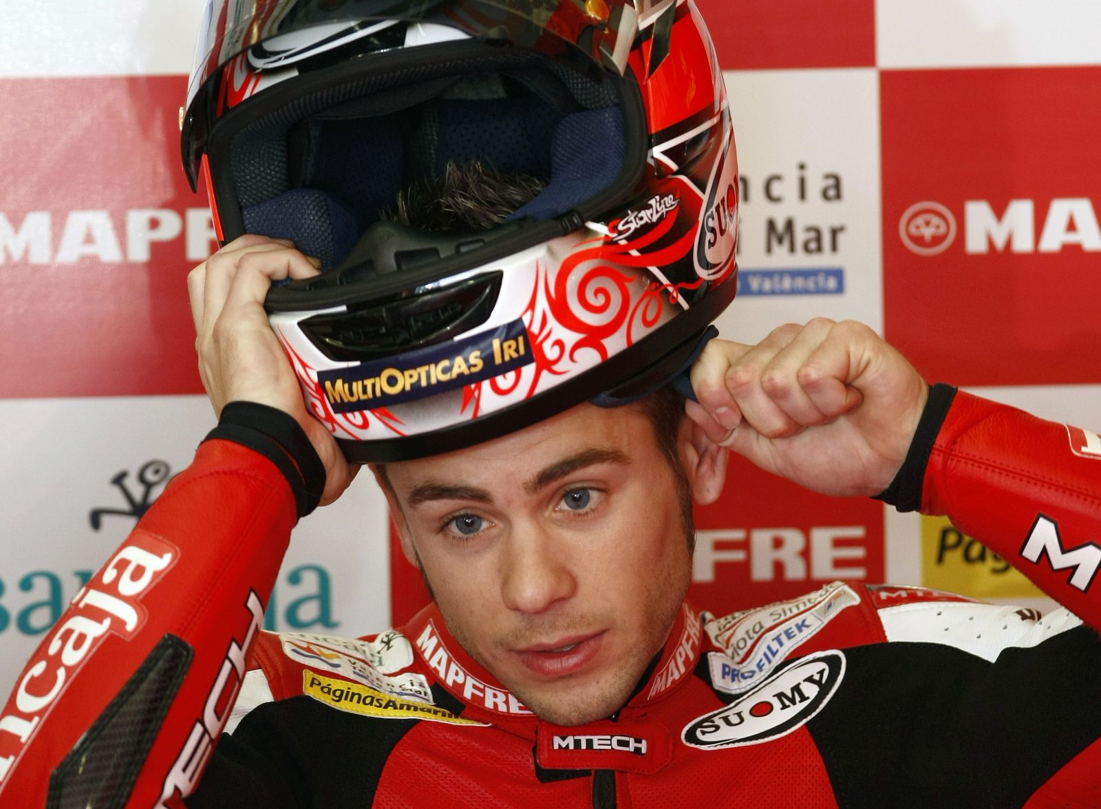 Aprilia 250cc rider Alvaro Bautista of Spain puts on his helmet in the pit area during the Spanish Grand Prix in Jerez