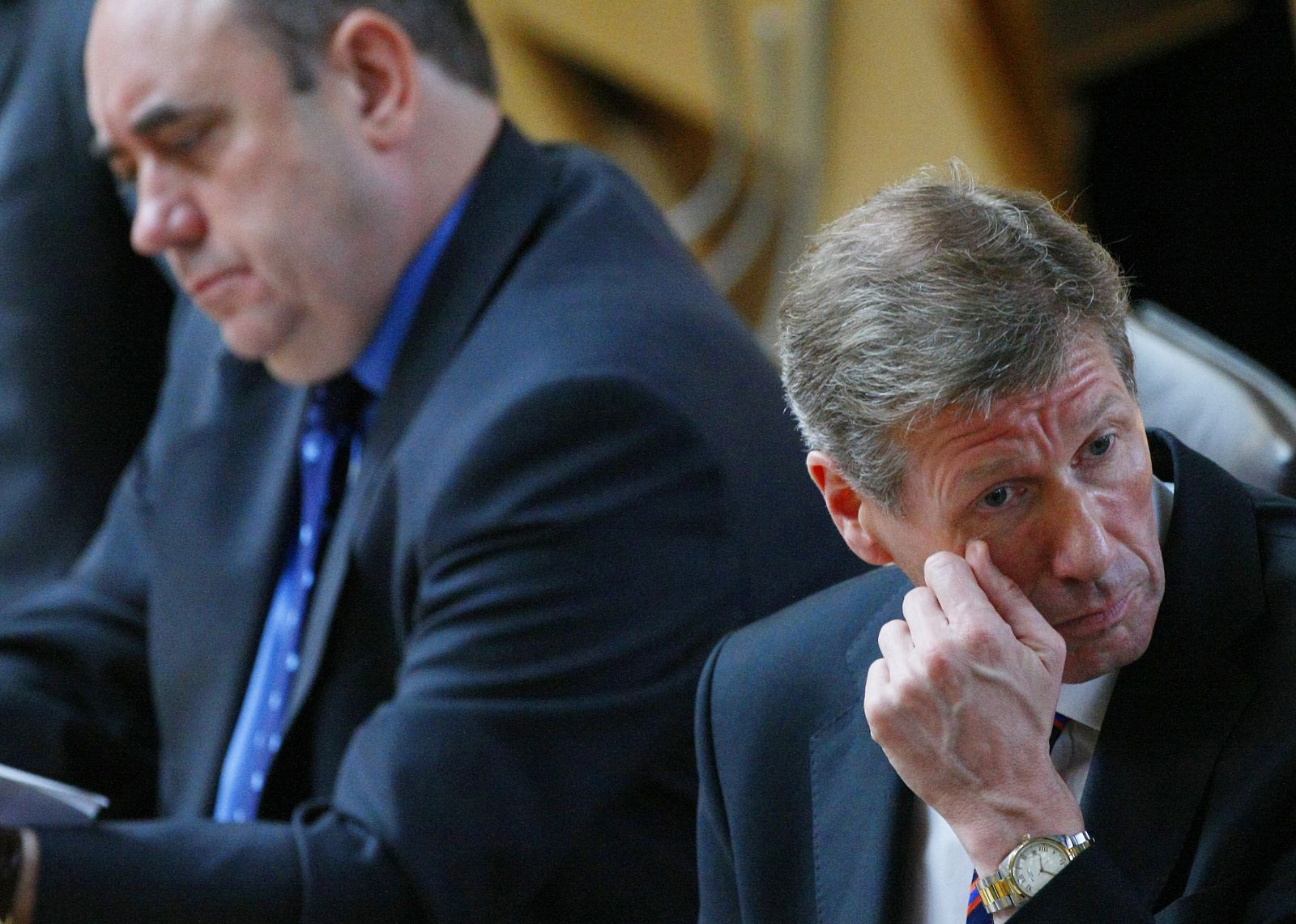 Scotland's Justice Secretary MacAskill and First Minister Salmond listen during an emergency session at the Scottish Parliament in Edinburgh, Scotland.