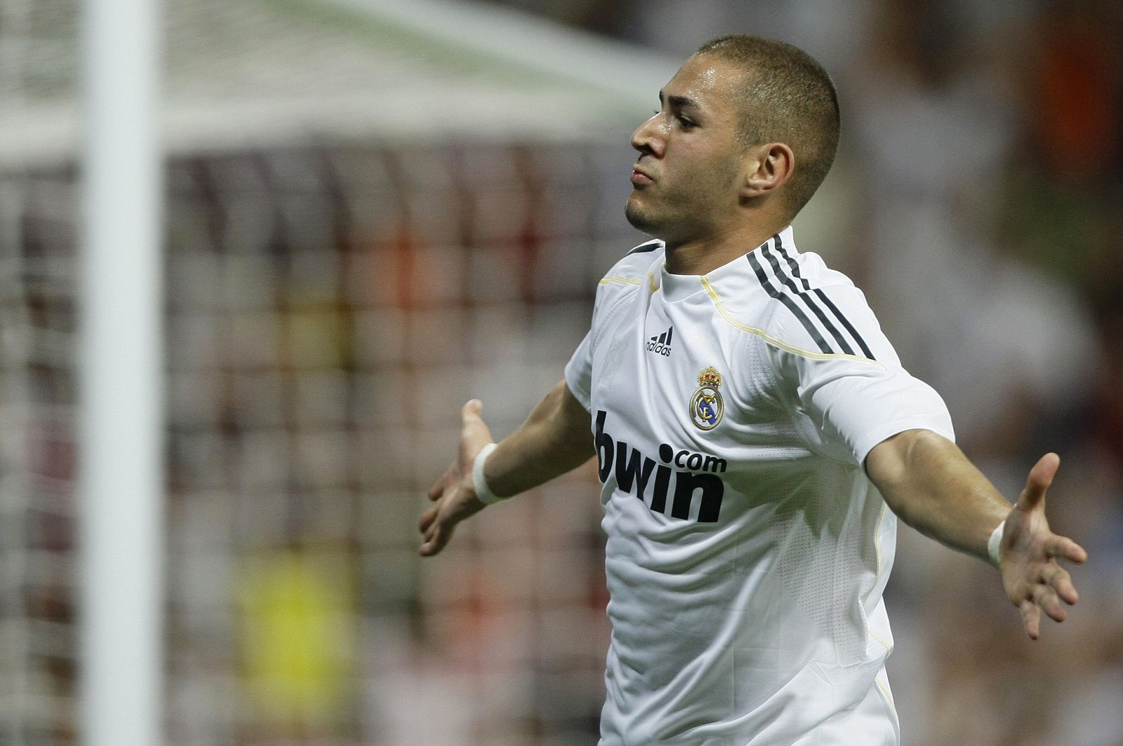 Real Madrid 's Benzema celebrate his second goal against Rosenborg during their Santiago Bernabeu trophy match in Madrid