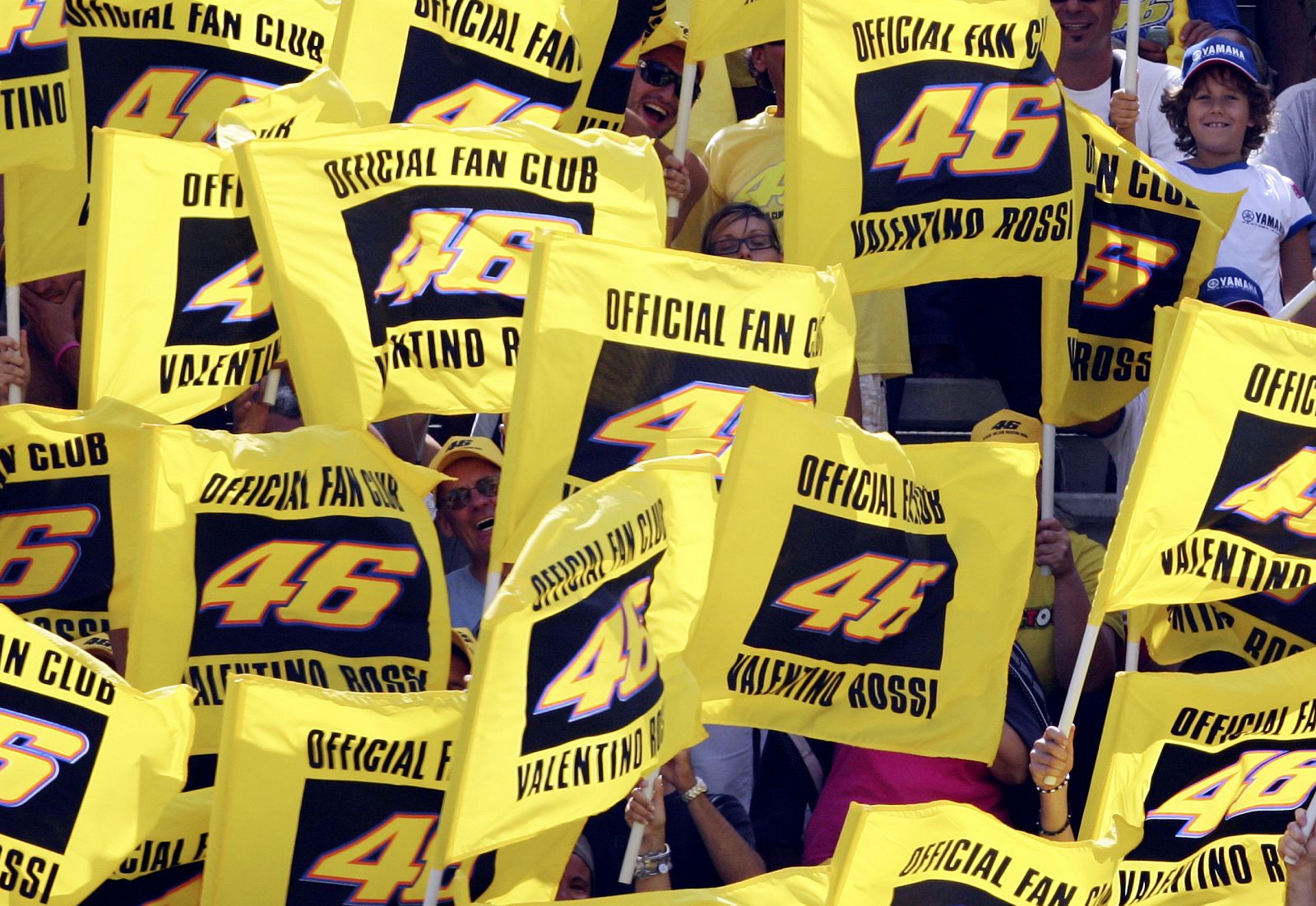 Supporters of Yamaha MotoGP rider Rossi of Italy cheer during the San Marino Grand Prix at Misano racetrack