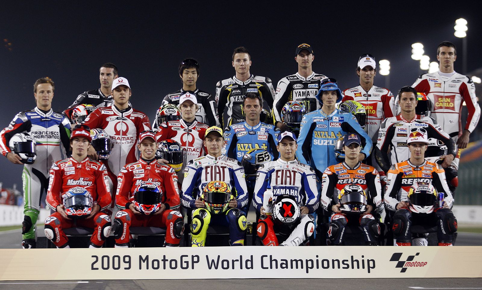 MotoGP riders pose for group photo before start of training session at MotoGP World Championship at the Losail international circuit in Doha