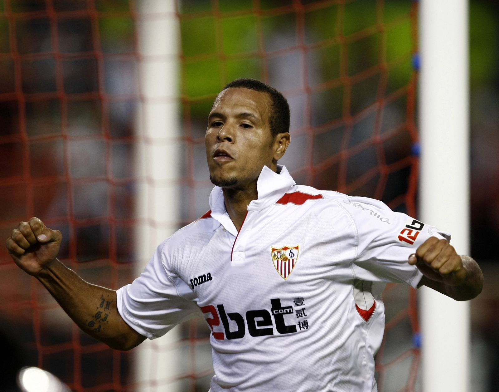Sevilla's Fabiano celebrates after scoring against Real Zaragoza during their Spanish First Division soccer match at Ramon Sanchez Pizjuan stadium in Seville