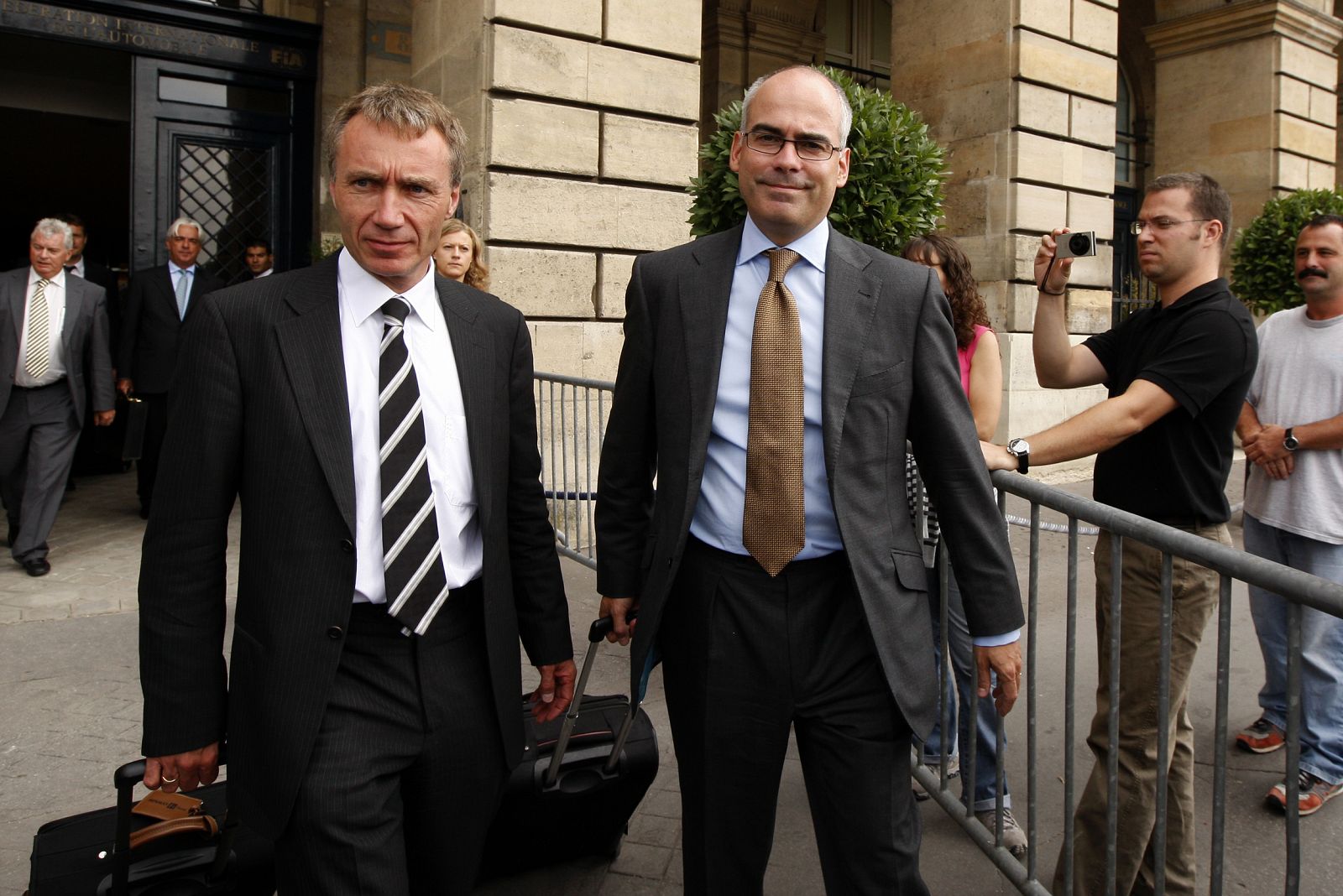 Renault Formula One Technical Director Bell and solicitor Ford leave International Automobile Federation (FIA) headquarters in Paris