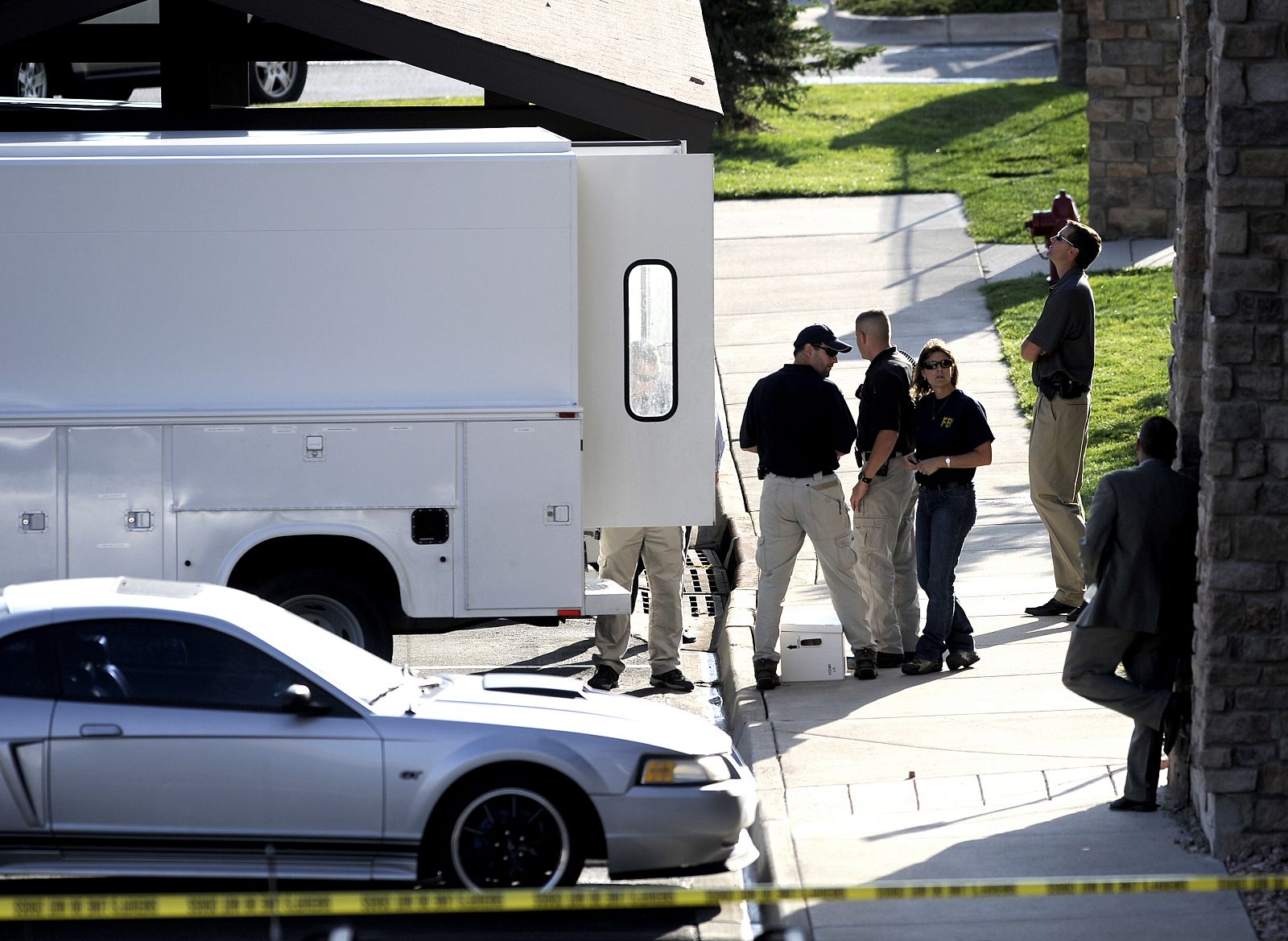 Federal Bureau of Investigation agents search the apartment of Najibullah Zazi in Aurora