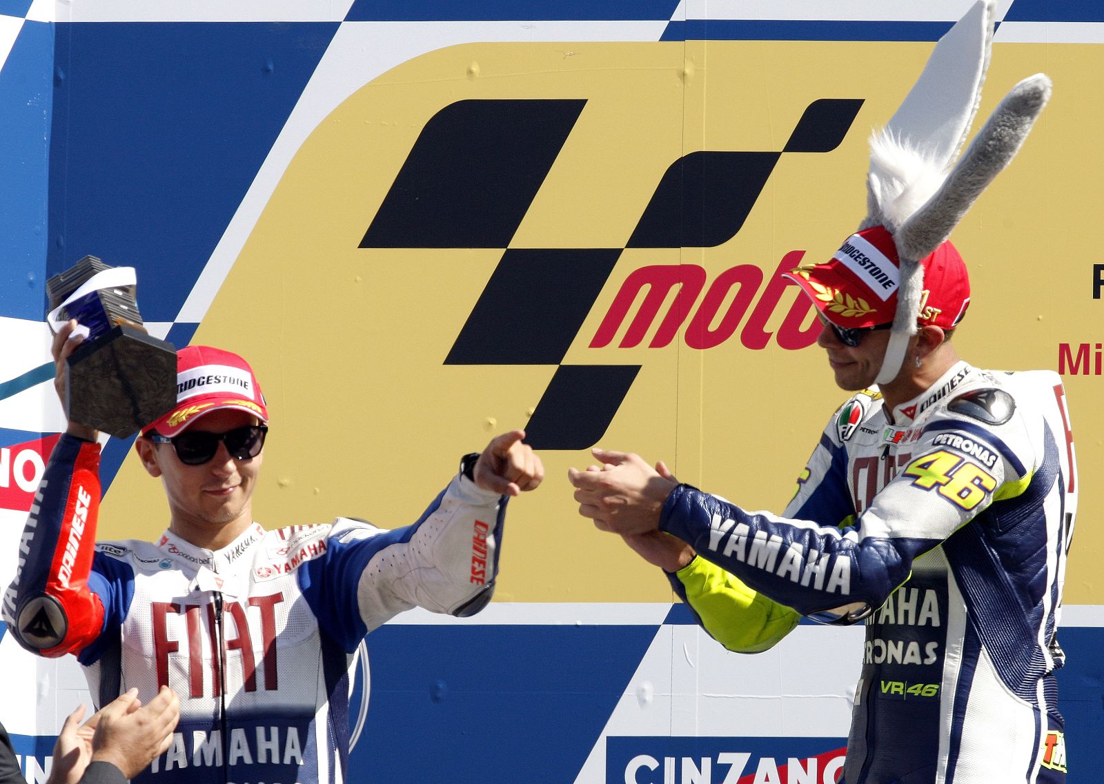 Yamaha MotoGP rider Rossi of Italy claps for his teammate Lorenzo of Spain, who finished second, after winning the Italian Grand Prix at the Misano circuit