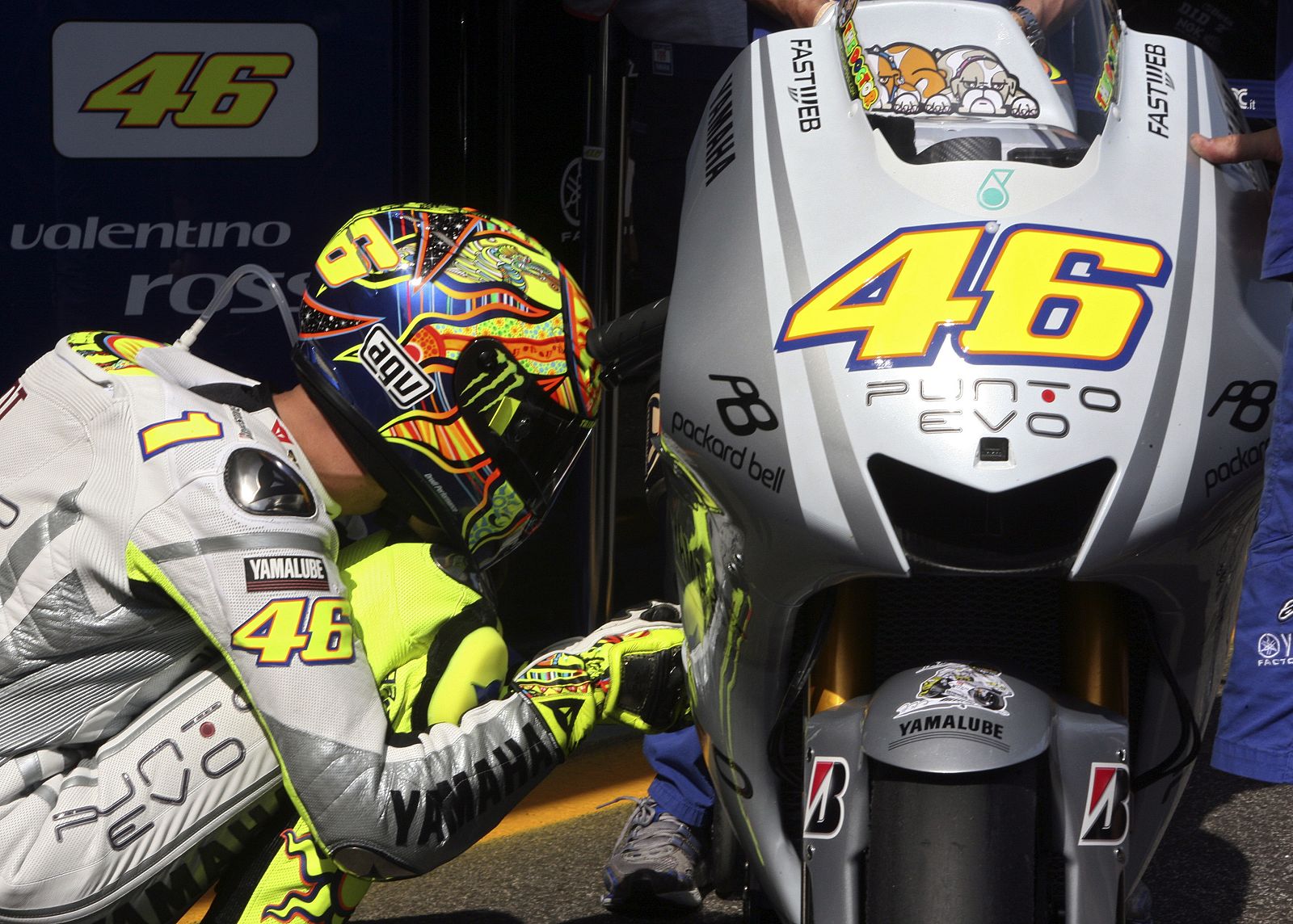 Yamaha MotoGP rider Rossi of Italy checks his bike during the qualifying practice of the Portuguese Grand Prix in Estoril