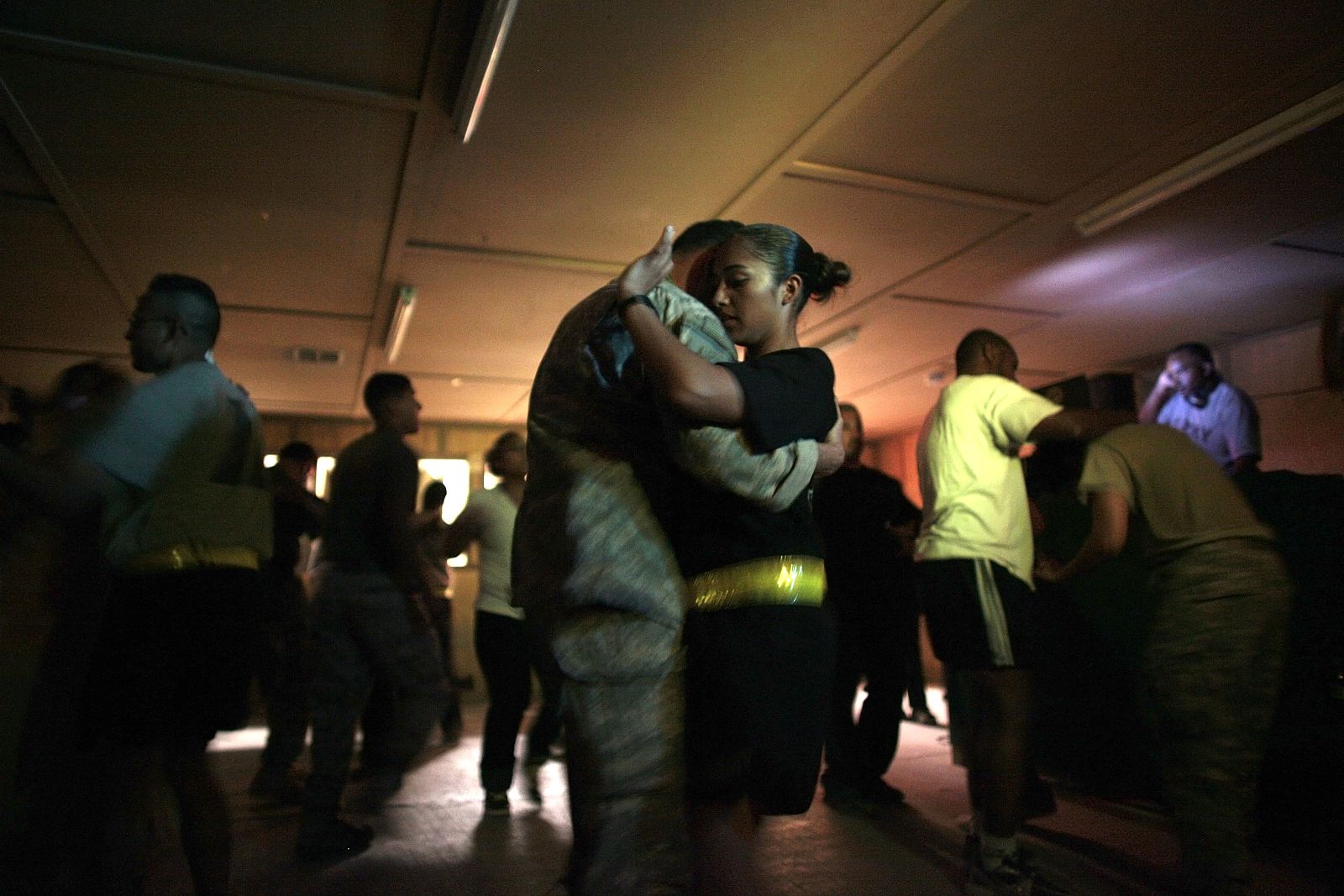 U.S. army soldiers dance during their time off at Kandahar Airfield