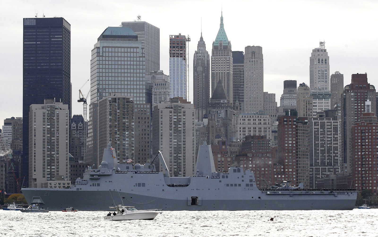 The USS New York LPD21 built with 7.5 tons of steel from the World Trade Center in her bow pauses on the Hudson River near the site of the former collapsed towers in New York