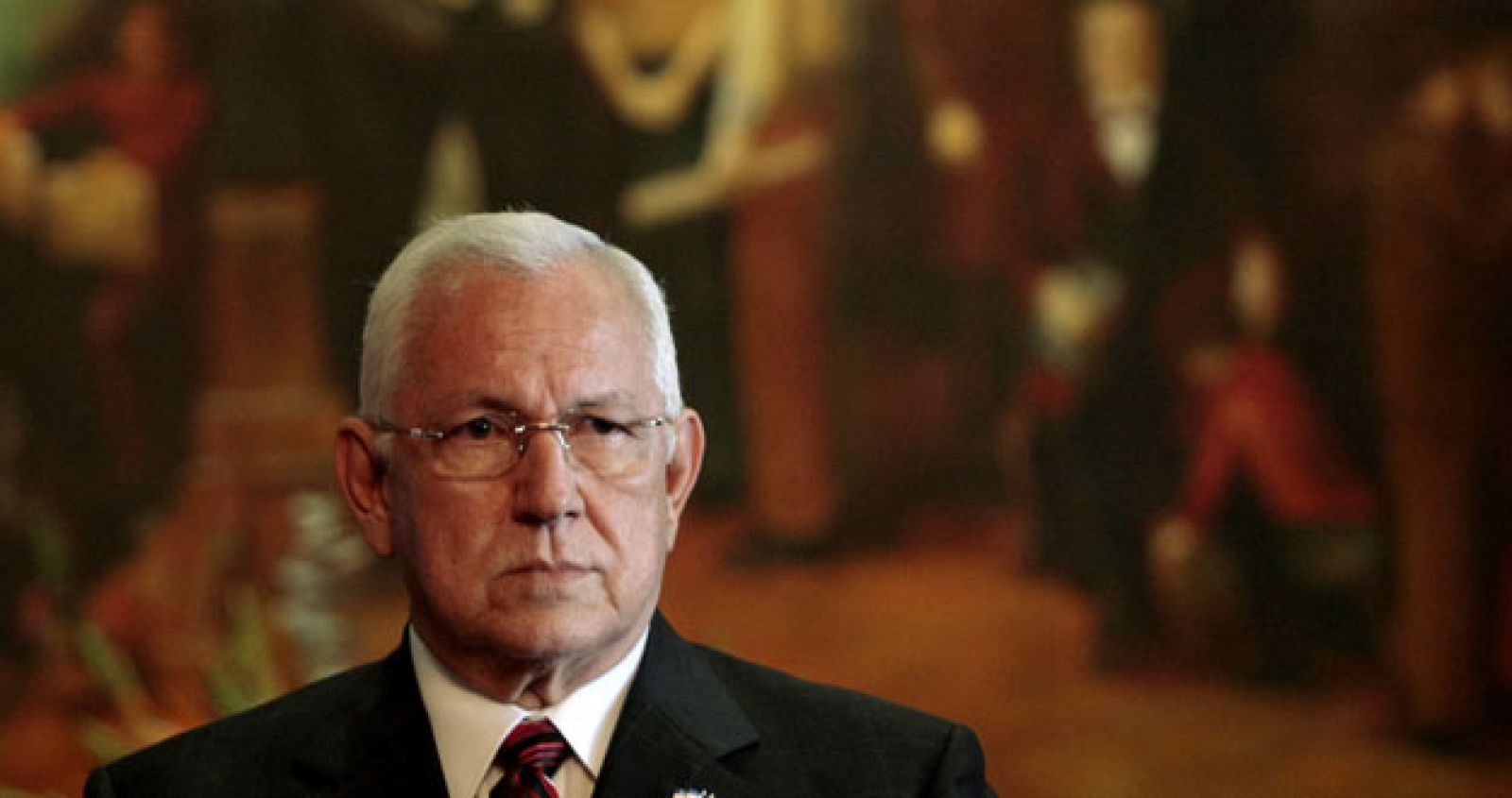 Honduras' interim President Roberto Micheletti listens to a journalist's question during a news conference at the Presidential House in Tegucigalpa