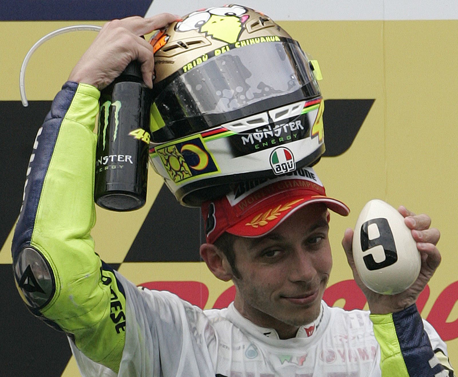 Yamaha MotoGP rider Valentino Rossi of Italy poses on the podium during Malaysian Grand Prix at Sepang circuit