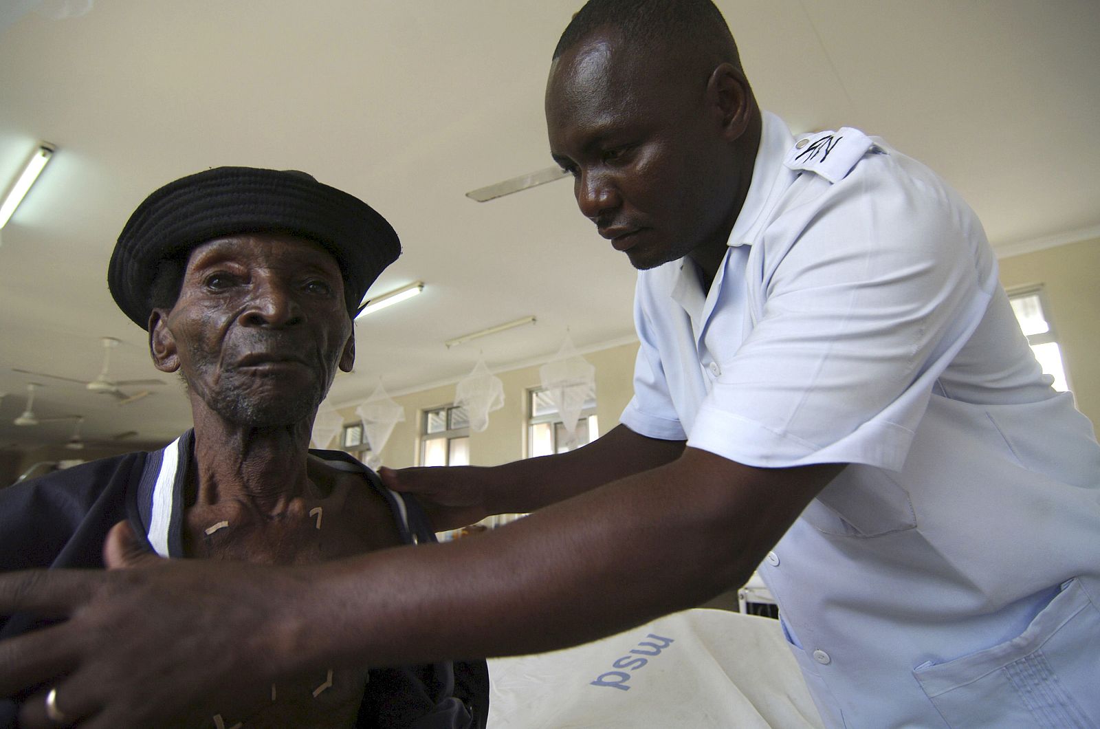 A nurse attends to a patient of cancer of the oesophagus in Tanzania?s cancer institute in Dar es Salaam