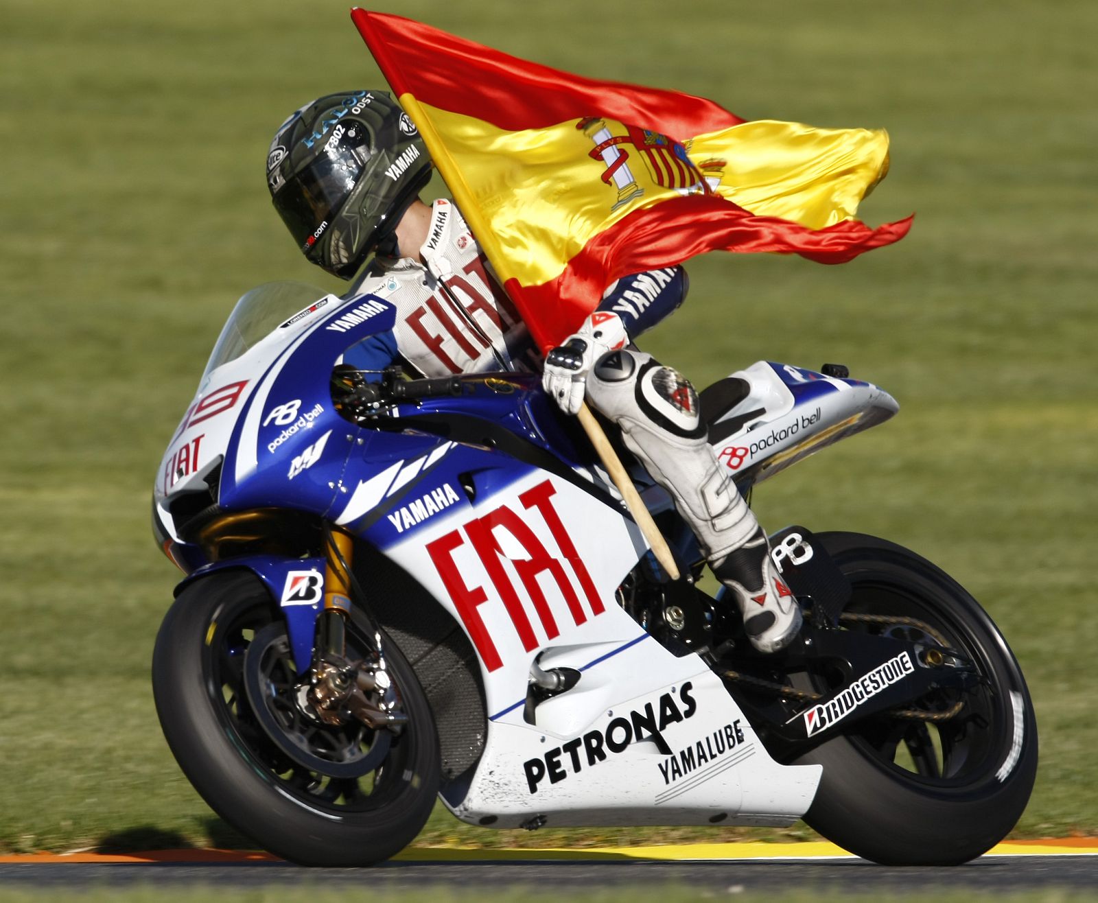Yamaha MotoGP rider Lorenzo of Spain celebrates his third position at the Valencia Grand Prix