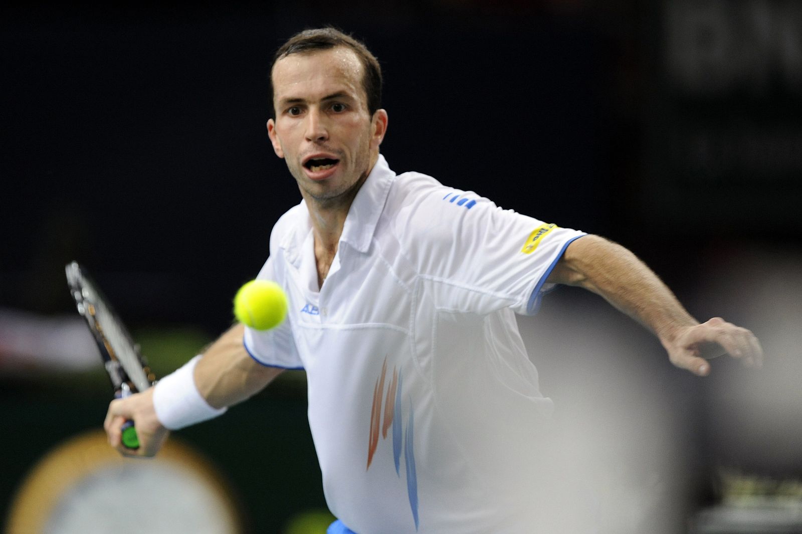 Radek Stepanek of the Czech Republic returns the ball during his semi-final match against Gael Monfils of France in the Paris Masters tennis tournament
