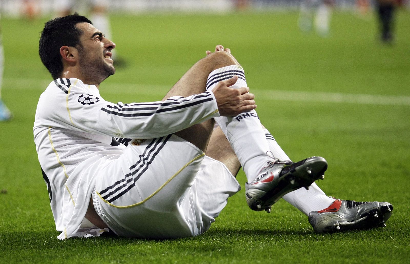 Real Madrid's Albiol grimaces in pain after a tackle during their Champions League soccer match against FC Zurich in Madrid
