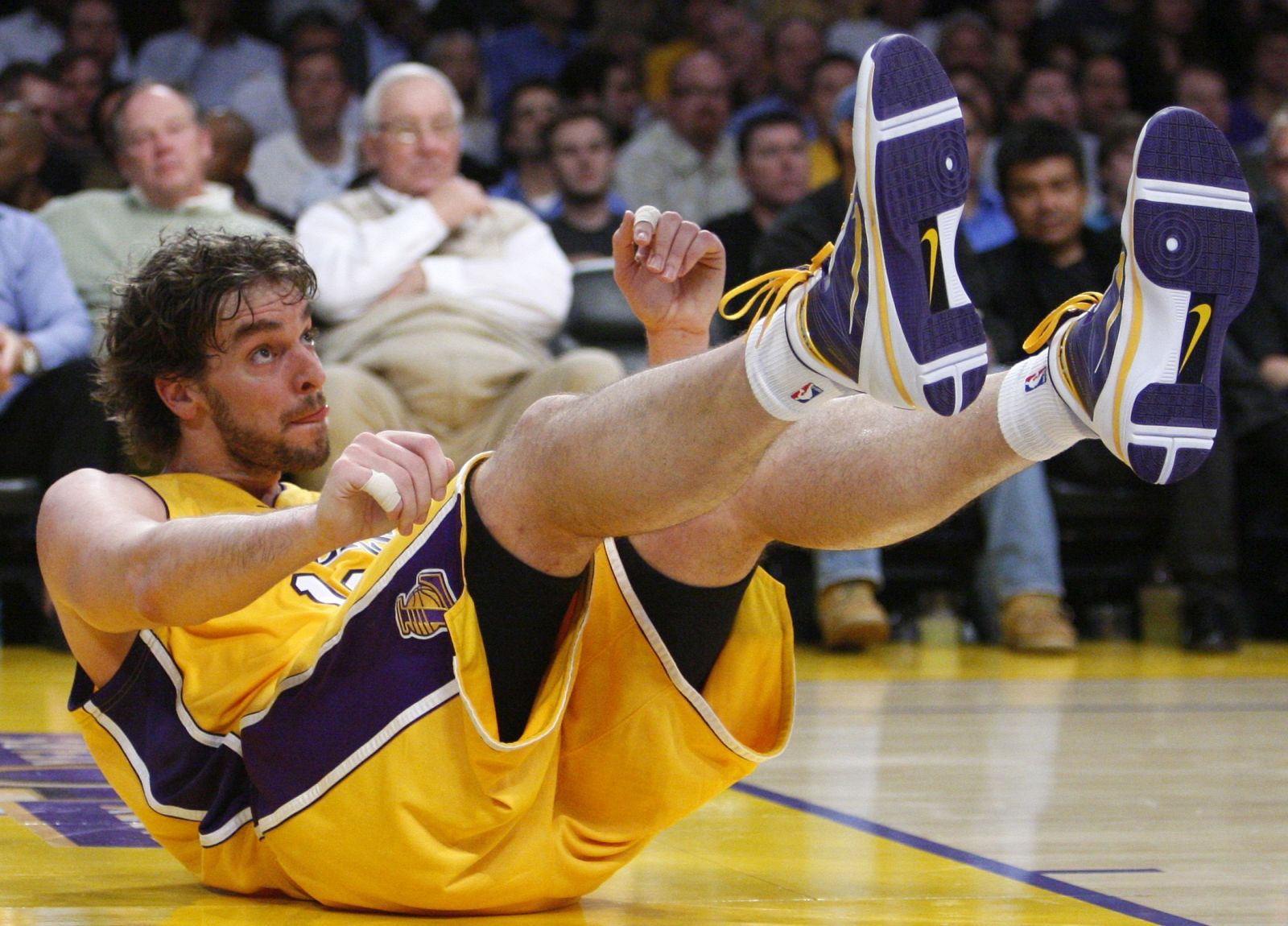 Lakers' Gasol lands on the floor during the second half of their NBA basketball game against the Bulls in Los Angeles