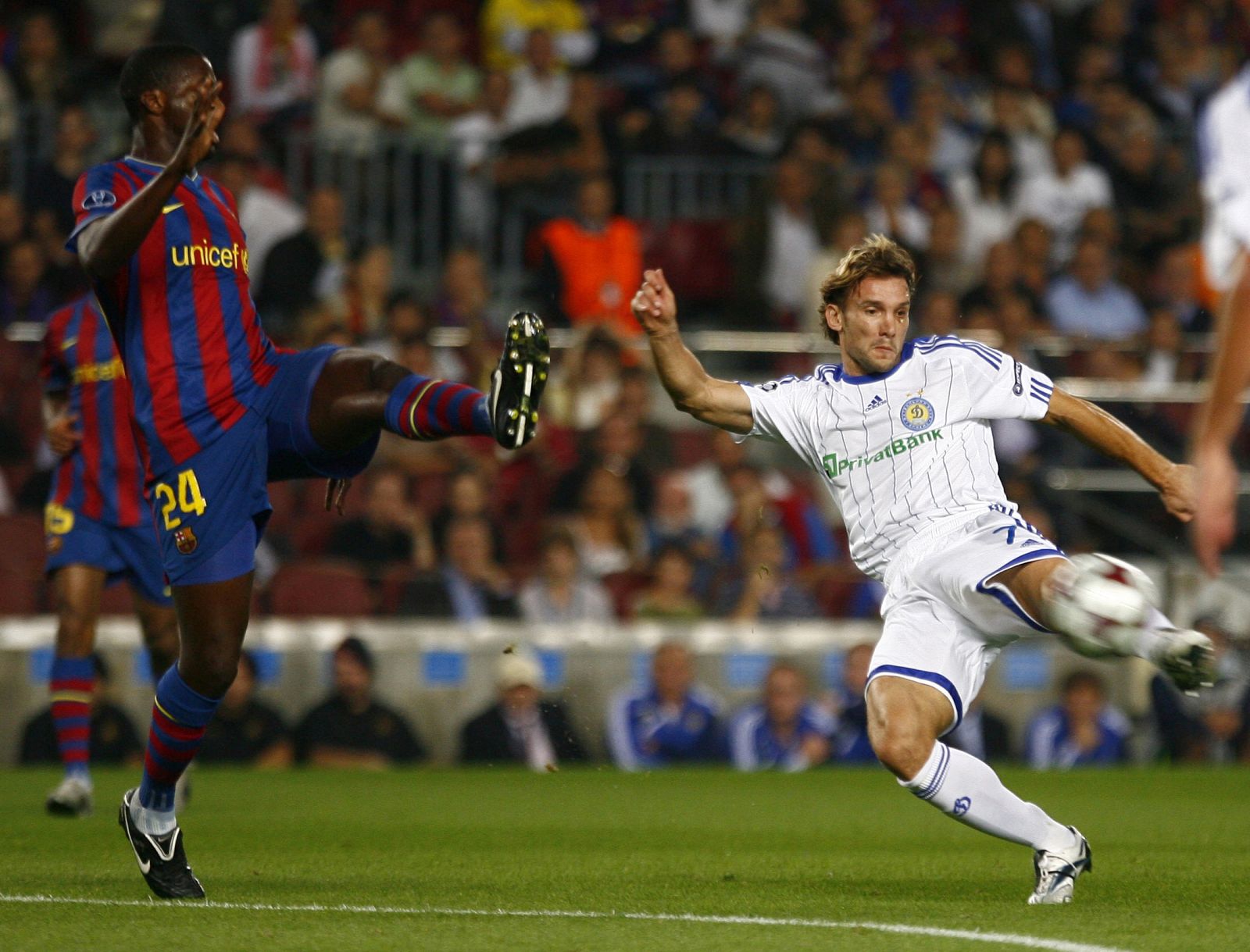 Dynamo Kiev's Shevchenko kicks past Barcelona's Toure during their Champions League soccer match at the Nou Camp stadium in Barcelona