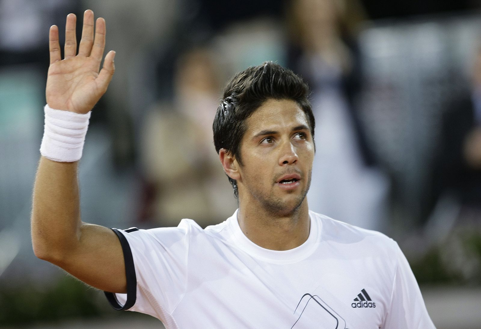 Spain's Verdasco waves to fans after winning his match against Argentina's Monaco at the Madrid Open tennis tournament