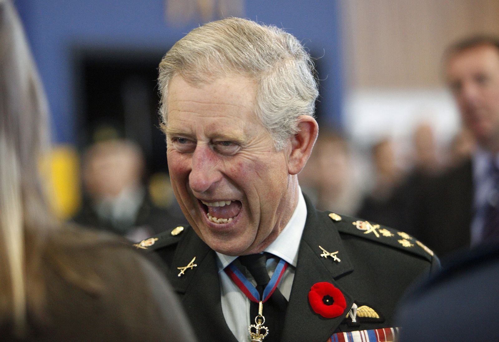 Britain's Prince Charles laughs while visiting soldiers and their families at Canadian Forces Base Petawawa near Ottawa