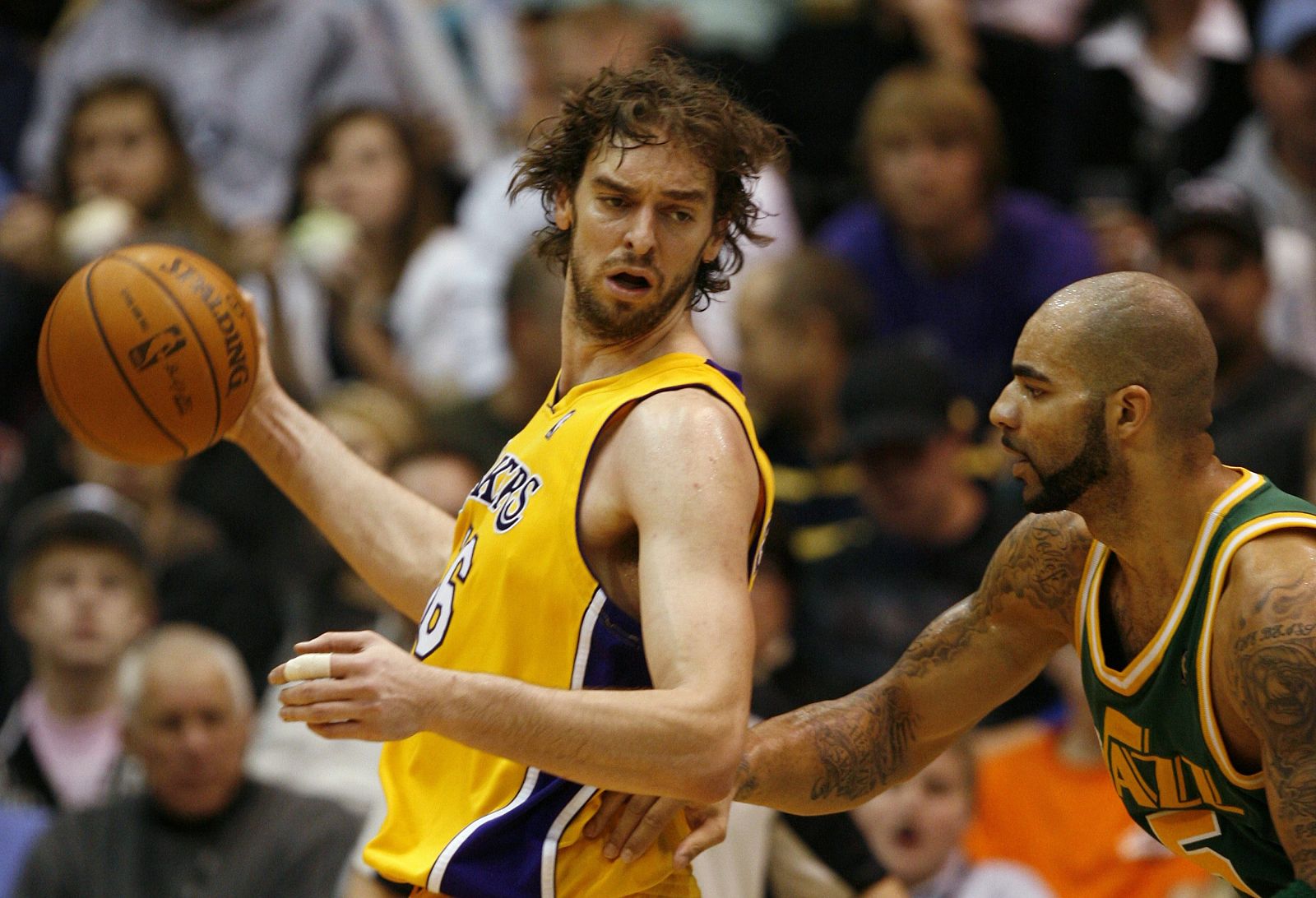 Los Angeles Lakers' Gasol is guarded by Utah Jazz's Boozer during the second half of their NBA basketball game in Salt Lake City